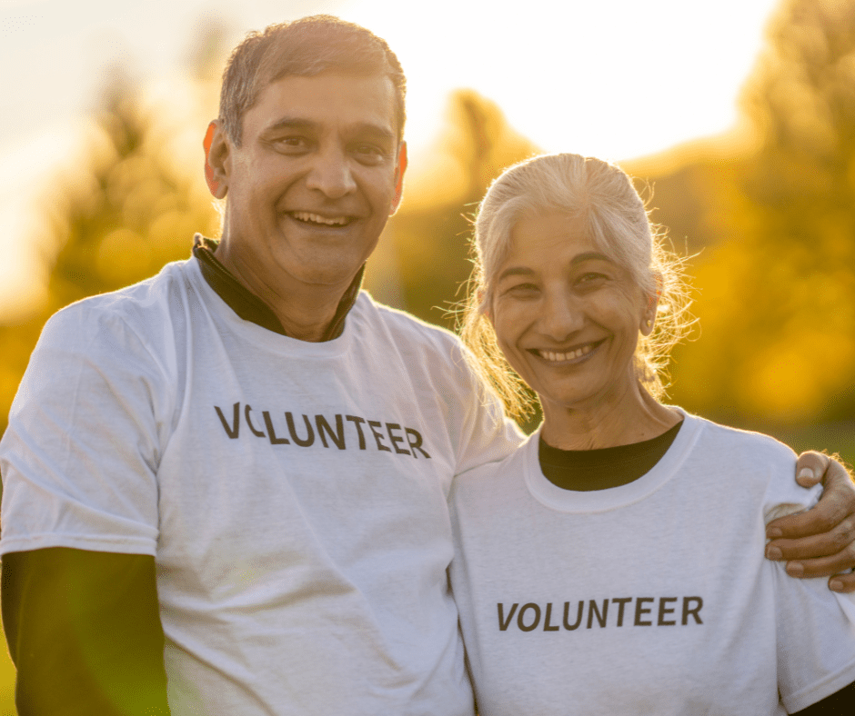 Adult couple wearing volunteer shirts