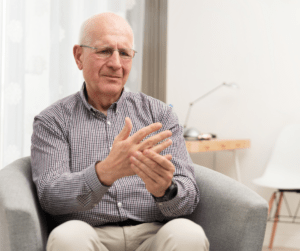 Senior man with Arthritis holding hand in pain