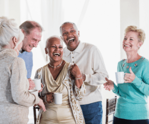 Group of residents laughing and enjoying coffee