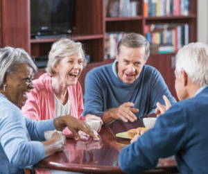 Group of men and women gathered and laughing