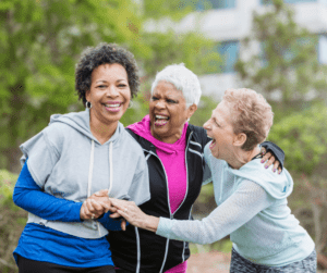 Senior women out on run laughing together